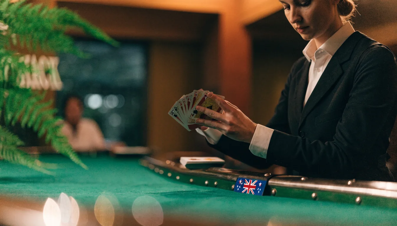 Live dealer dealing physical blackjack cards in a New Zealand studio