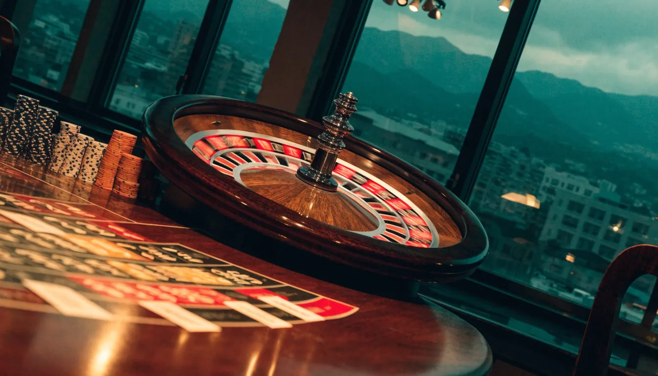 Spinning roulette wheel on a casino table with Auckland cityscape in the background
